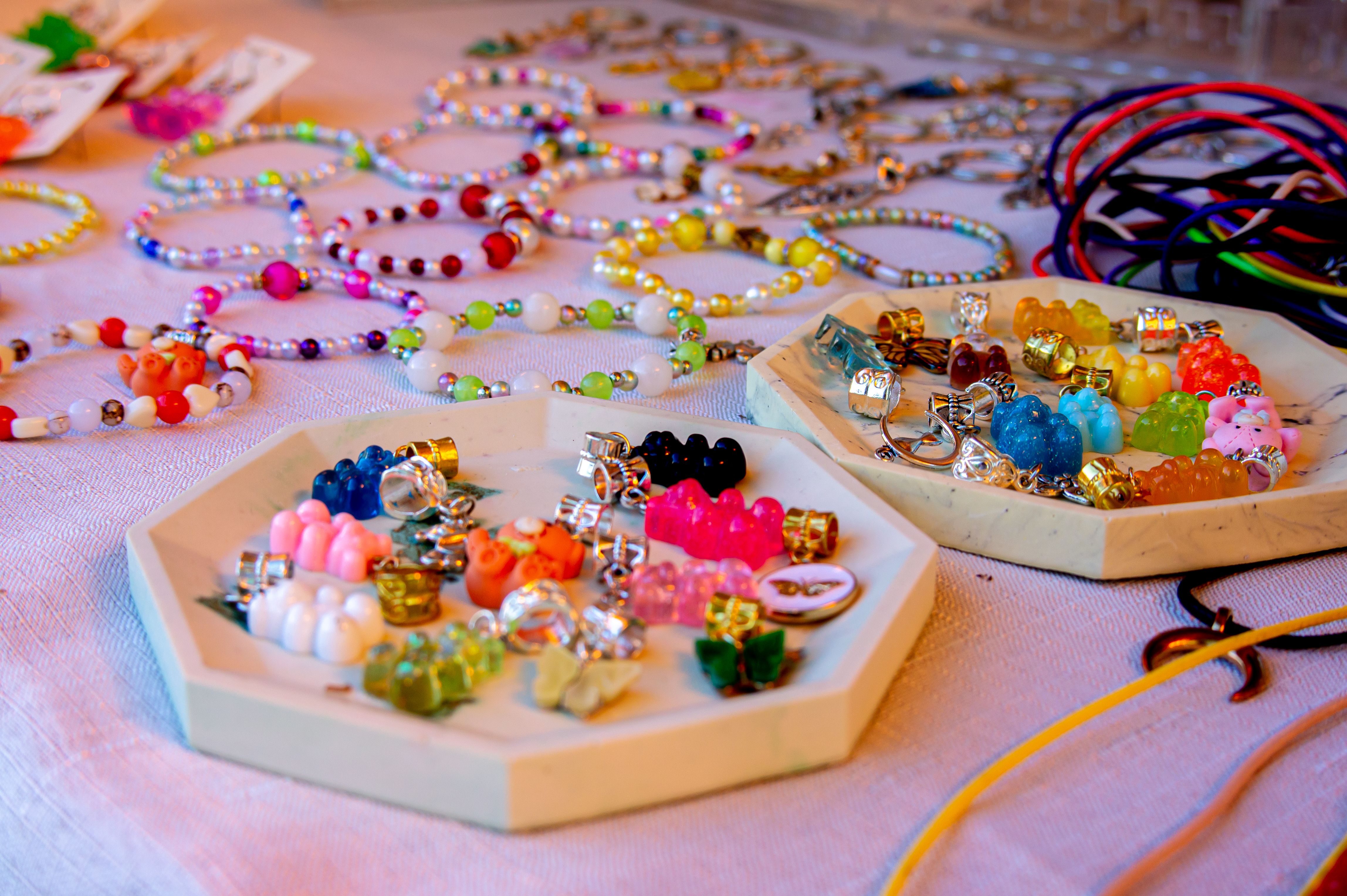 Guests creating bracelets at The Charm Bar